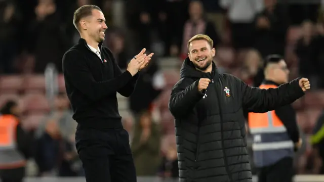 Tonda Eckert (left) and Leo Scienza (right) celebrate after winning a game