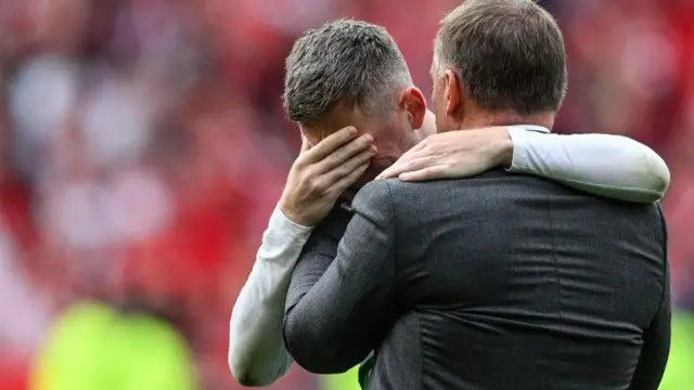 Brendan Rodgers comforts Callum McGregor