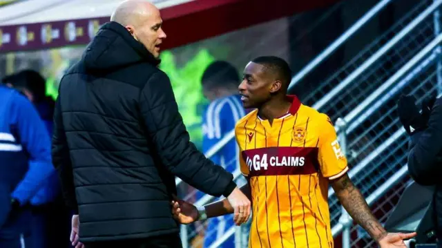 Motherwell's Jens Berthel Askou and Tawanda Maswanhise exchange words