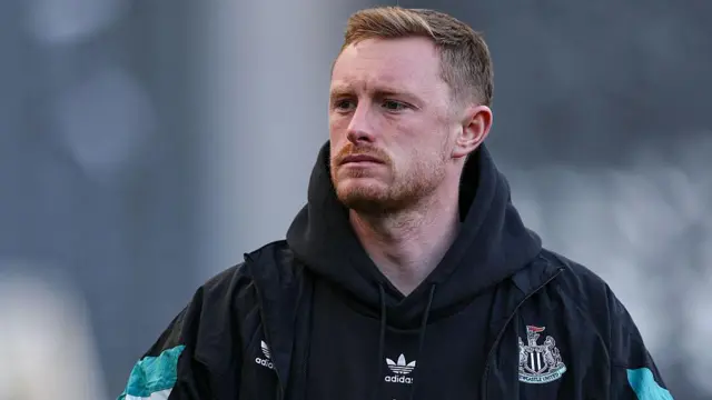 Sean Longstaff looks on before match