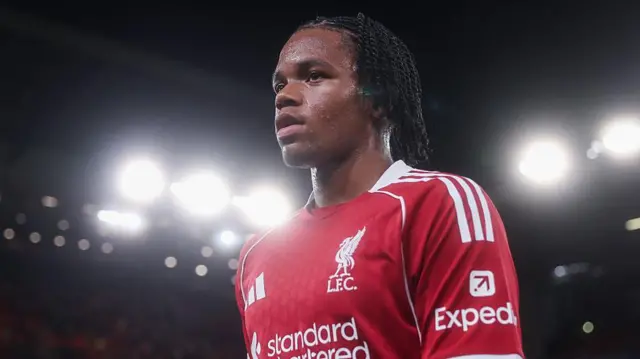 Rio Ngumoha looks on under the lights for Liverpool