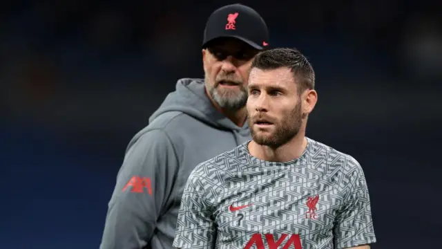 James Milner in training. Jurgen Klopp stands behind him.