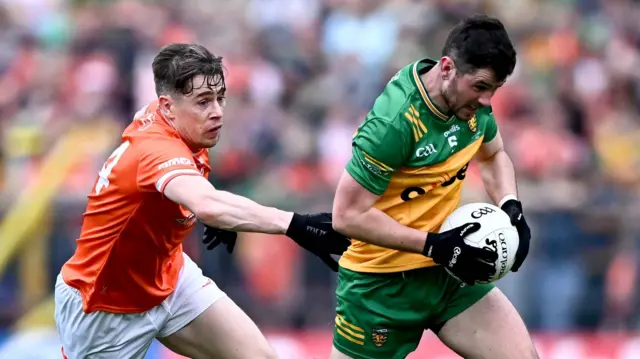 Armagh's Andrew Murnin chases Donegal's Ryan McHugh