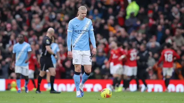 Erling Haaland of Manchester City looks dejected 