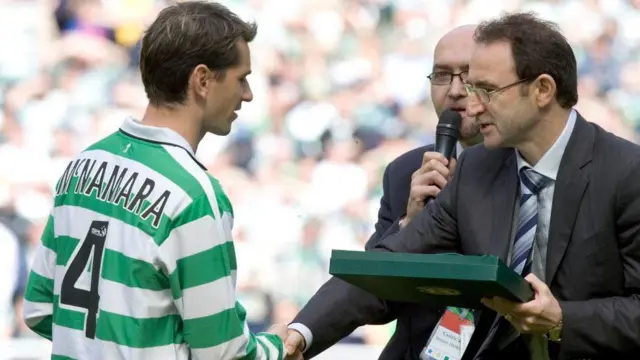 Martin O'Neill (right) presents Jackie McNamara with a testimonial gift.