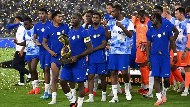 Moises Caicedo of Chelsea FC holds the trophy after winning the Indonesia Super Cup