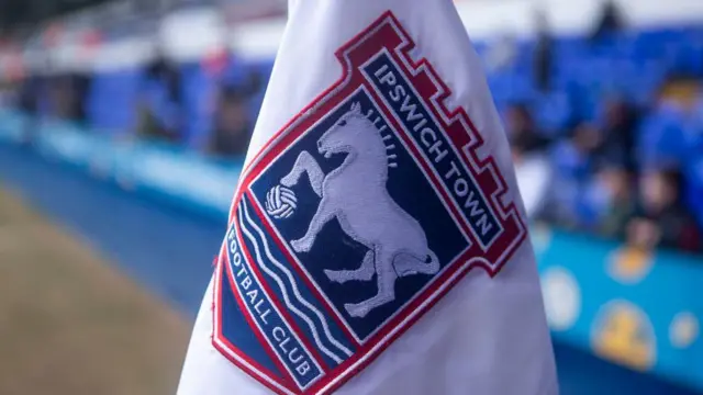 A corner flag at Portman Road with the Ipswich Town club badge on it