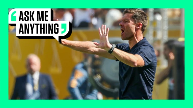 Xabi Alonso giving instructions to his players from the touchline. The image is surrounded by a green border with 'Ask Me Anything' in the top corner.
