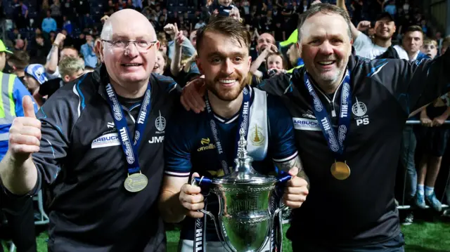 Falkirk Manager John McGlynn , Brad Spencer and Paul Smith celebrate with the William Hill Championship Trophy during a William Hill Championship match between Falkirk and Hamilton Academical at the Falkirk Stadium