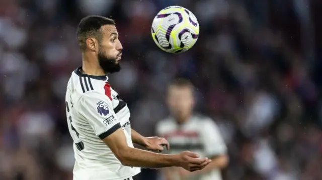 Manchester United's Noussair Mazraoui controls the ball against Crystal Palace