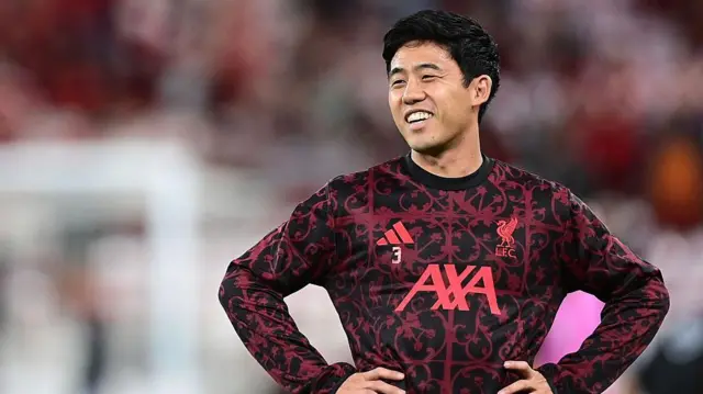 Wataru Endo warms up before a Champions League match