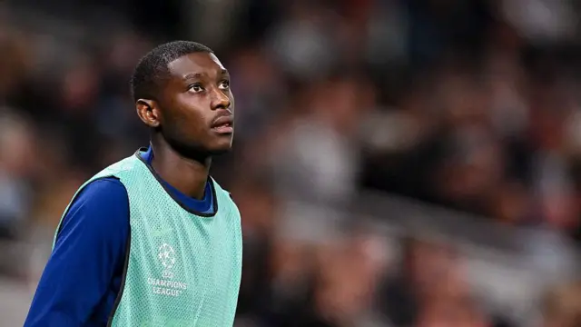 Randal Kolo Muani looks on from the sideline during the Champions League match between Tottenham and Villarreal