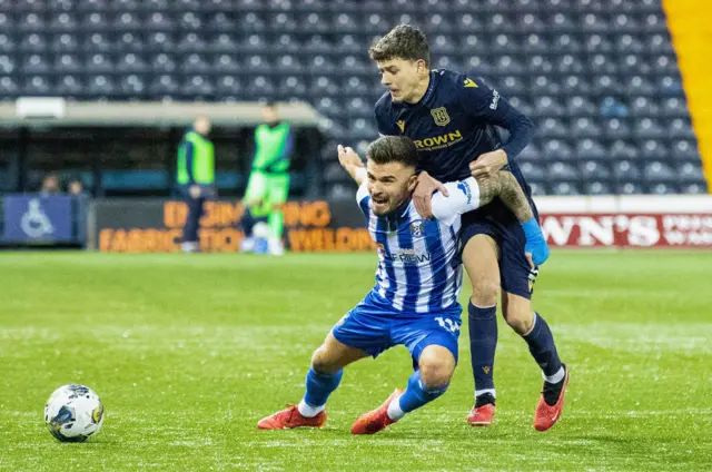 Owen Beck wrestles with Kilmarnock's Danny Armstrong