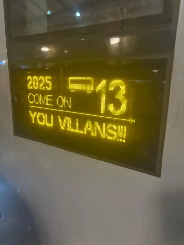 Sign on a train saying 'Come on you Villians'