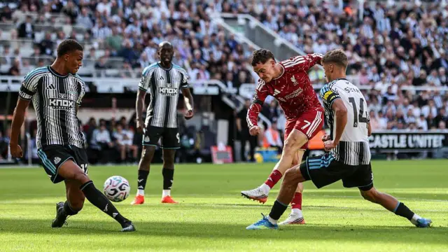 Florian Wirtz of Liverpool takes a shot on goal during the Premier League match between Newcastle United and Liverpool at St. James's Park in Newcastle, United Kingdom.
