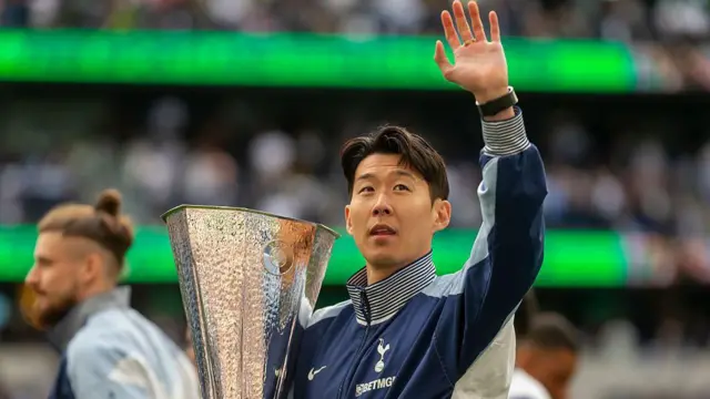 Son holds Europa League trophy and waves to fans