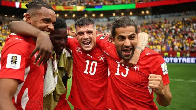 Xhaka celebrates with Switzerland players
