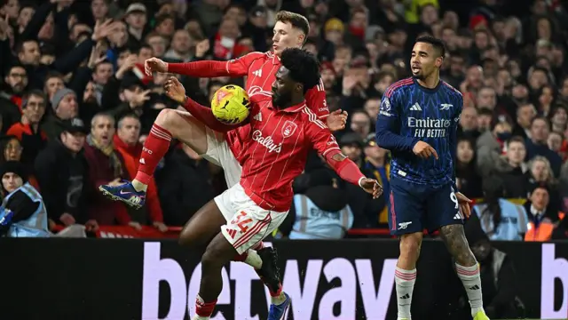 Ola Aina of Nottingham Forest controls the ball 