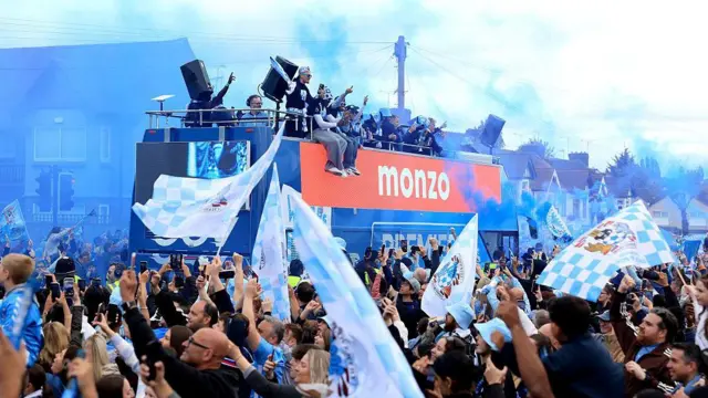 A general view as players of Coventry City celebrate on an open tour bus