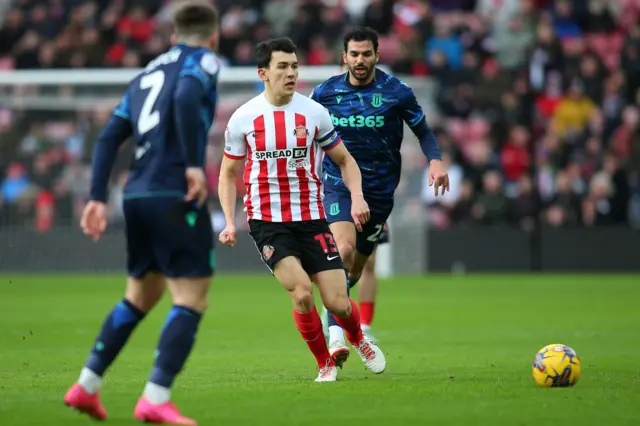 Luke O'Nien of Sunderland is making a pass during the Championship match between Sunderland and Stoke City at the Stadium Of Light in Sunderland, on January 27, 2024