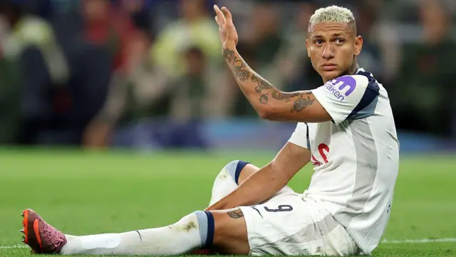 Richarlison sits on the pitch against Villarreal