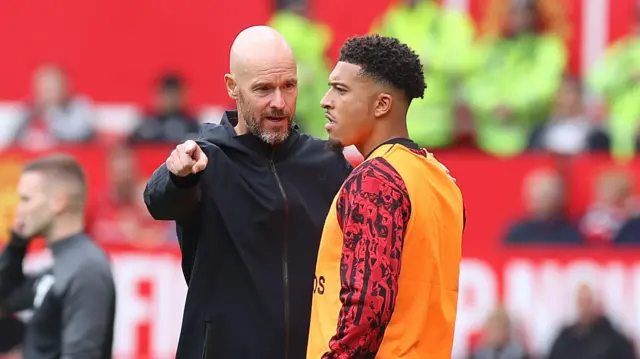 Erik ten Hag speaks to Jadon Sancho during a pre-season match