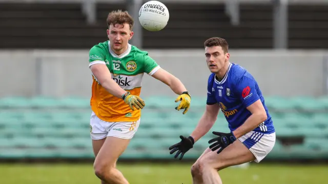 Offaly's Keith O'Neill with Peter Corrigan of Cavan 
