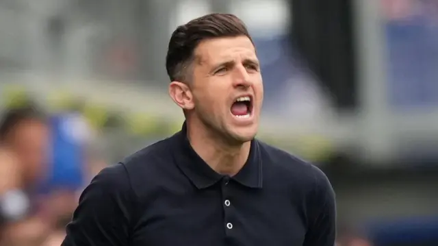 John Mousinho shouting