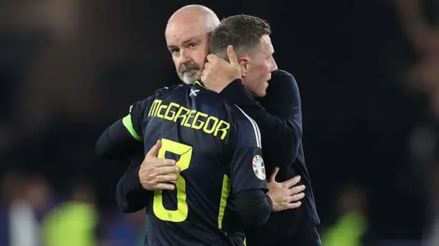 Steve Clarke embraces Callum McGregor after what proved to be the midfielder's final Scotland appearance, the 1-0 defeat by Hungary at Euro 2024