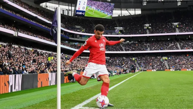 Morgan Gibbs-White of Nottingham Forest takes a corner at Tottenham Hotspur Stadium