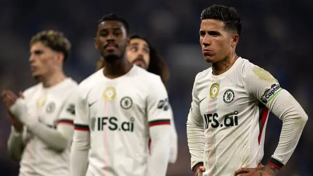 Enzo Fernandez of Chelsea appears dejected alongside team mates Jorrel Hato, Marc Cucurella and Alejandro Garnacho