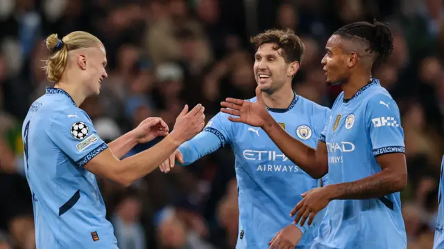 Manchester City players celebrate goals against Sparta Prague