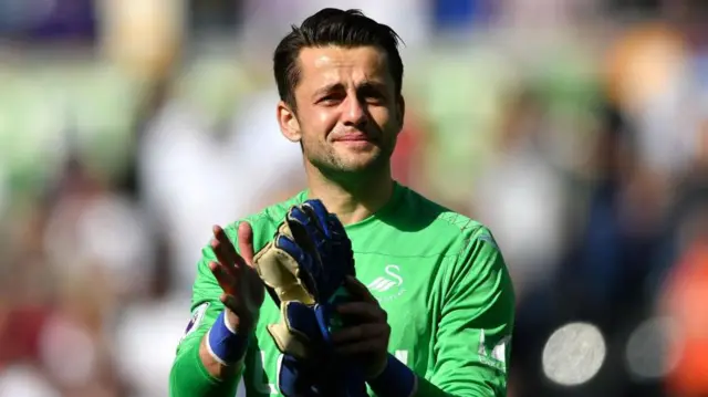 A teary-eyed Lukasz Fabianski applauds the Swansea City supporters 