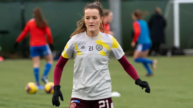 Eilidh Davies warming up in Hearts training kit