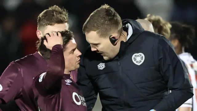 Hearts' Cammy Devlin is forced off injured during a Scottish Gas Men's Scottish Cup match between St Mirren and Hearts at the SMiSA Stadium