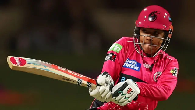 Sophia Dunkley plays a shot