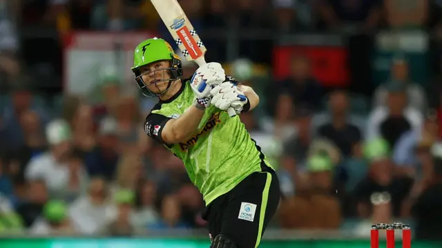 Sydney Thunder batter Sam Billings hits a shot