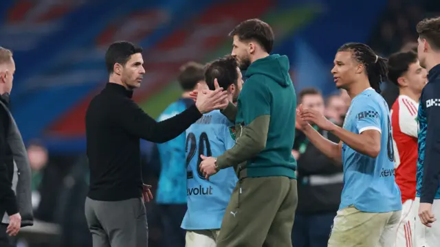 Mikel Arteta shakes hands with Ruben Dias after League Cup final