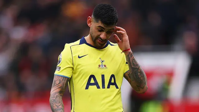 Cristian Romero of Tottenham Hotspur reacts as he leaves the game.
