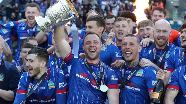 Linfield celebrate after lifting the Gibson Cup