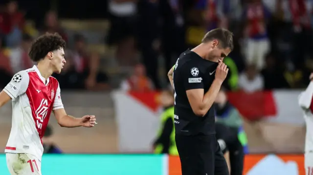 Micky van de Ven reacts during match