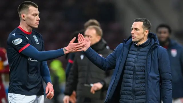 Ross County manager Don Cowie (R) and Kacper Lopata (L)