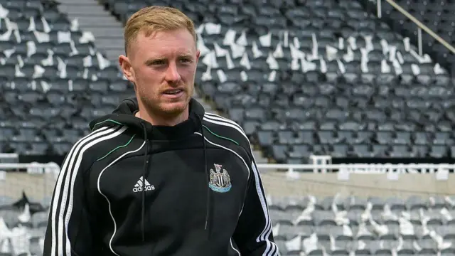 Sean Longstaff looks on in training gear at St James' Park