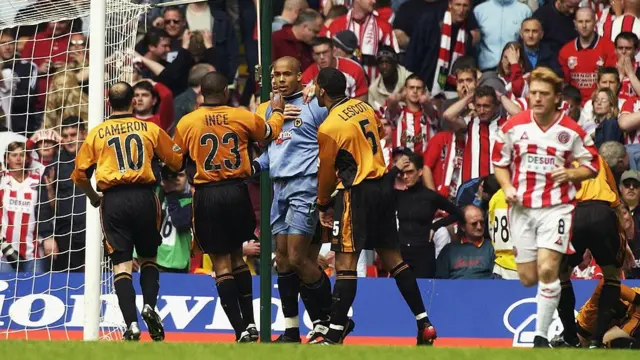 Wolves players celebrate after Matt Murray saves a shot on goal