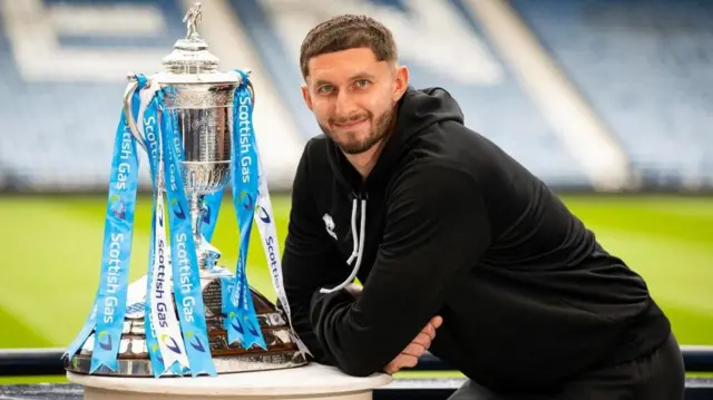 Aston Oxborough with Scottish Cup trophy