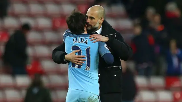 Pep Guardiola embraces David Silva