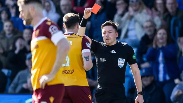 Kofi Balmer is shown a red card