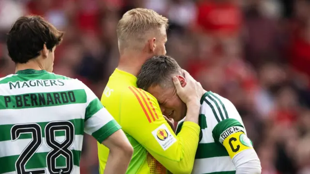 Callum McGregor is consoled by Kasper Schmeichel 