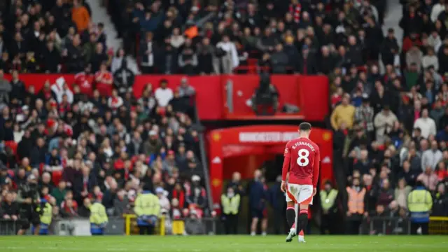 Bruno Fernandes of Manchester United leaves the pitch after being shown a red card