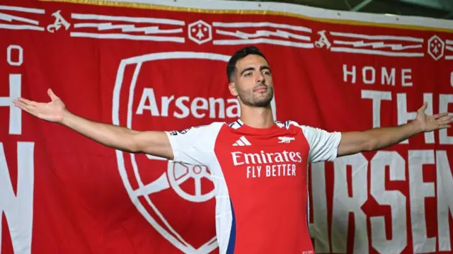 Mikel Merino poses in Arsenal shirt after signing for the Gunners